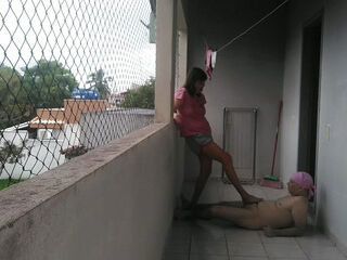 My wife teasing me on balcony