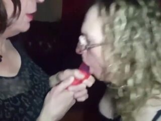 Essex Girl Lisa and TGirl Gigi gag on a shared double dildo