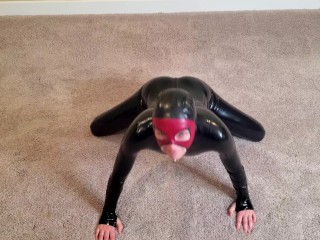 Latex Yoga - Sexy small rubber doll stretches and flexes her latex catsuit in different yoga poses
