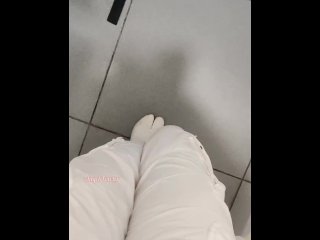 Girl pissing in airport toilet.