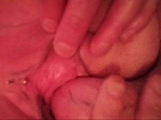 Close up reverse cowgirl stretching out her pussy all with a bittplug in