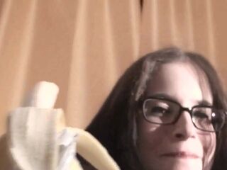 Spex brunette talking dirty while eating banana by Femdom Austria