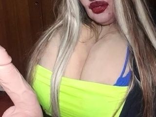 Susi is sitting and rubbing toy cock enjoy it